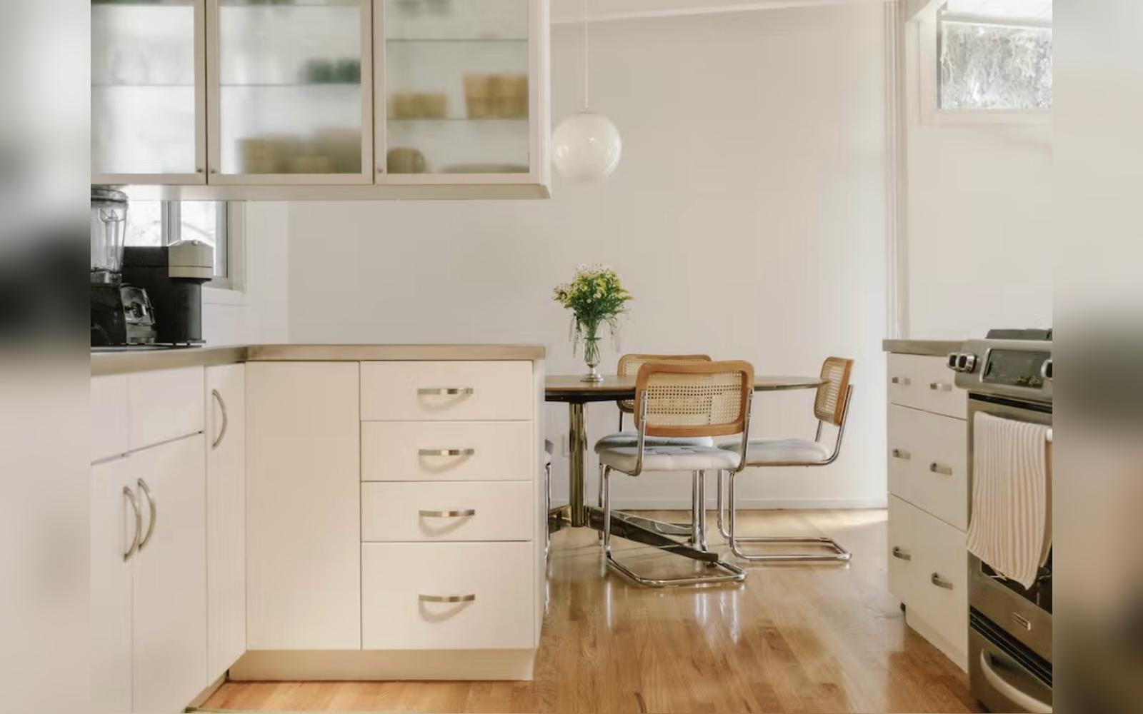 After: kitchen with cabinets refinished bright white by JEI Painting